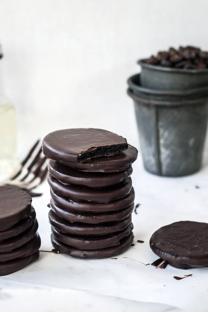 vegan thin mints with dark chocolate coating, stacked up